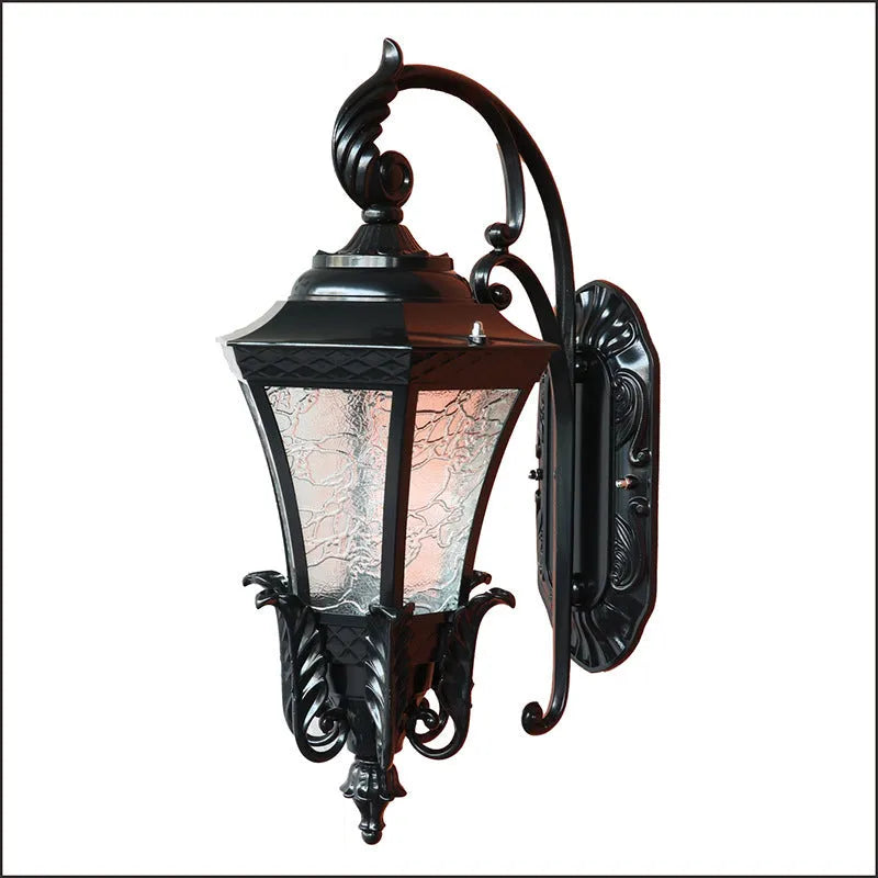 Black European-style solar outdoor wall lamp with remote control on a brick wall.