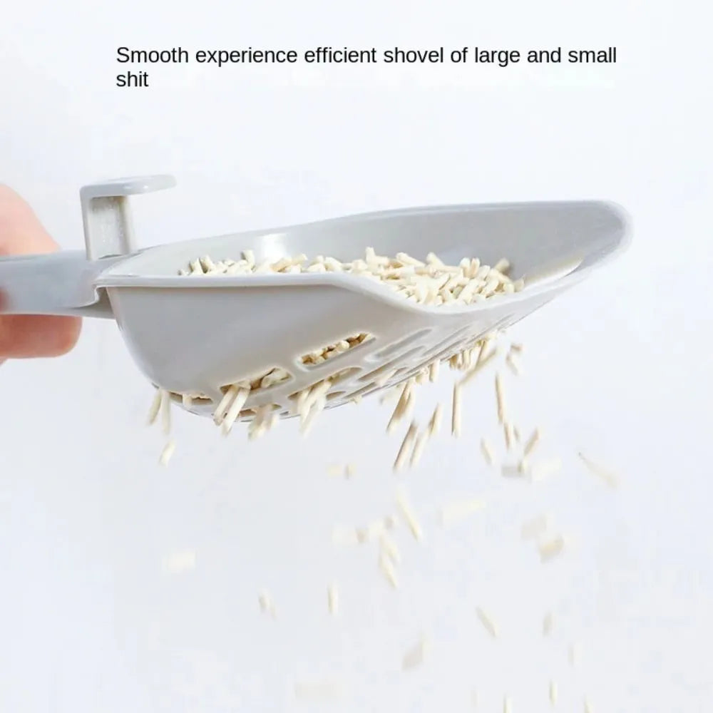 Grey plastic cat litter scoop and self-cleaning base set for litter box maintenance.