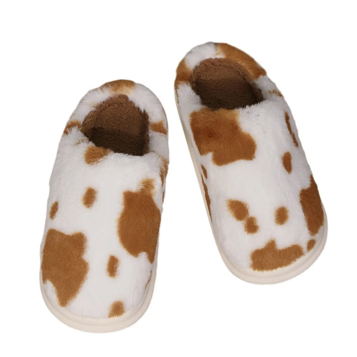 Cozy cow print plush slippers with soft, cushioned soles and non-slip outsoles for indoor comfort and warmth