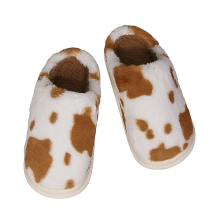 Cozy cow print plush slippers with soft, cushioned soles and non-slip outsoles for indoor comfort and warmth