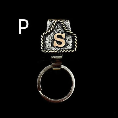 Handmade cow tag design metal keychain on a keyring, shown in one of many available colours.