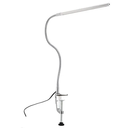 Silver aluminium alloy USB-powered LED nail table lamp with a long arm clip attached to a table edge.