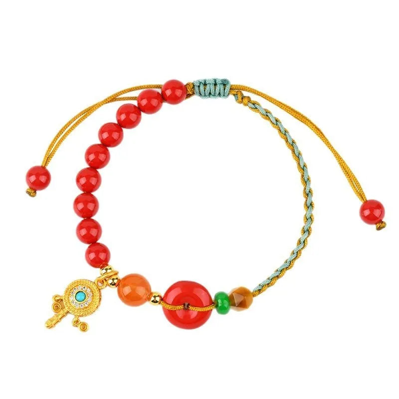 Hand-woven cinnabar peace blessing bracelet in emperor red sand colour with geometric design