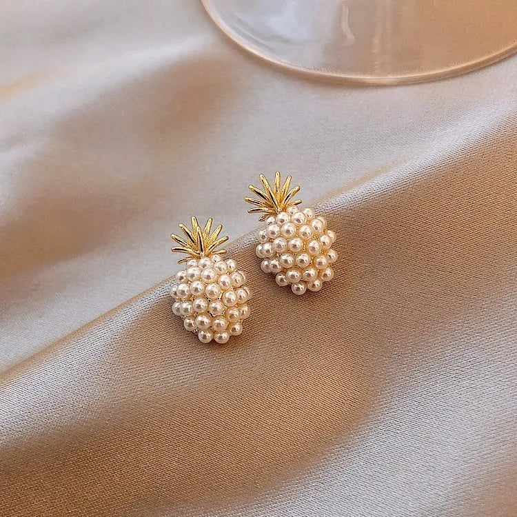 Korean style pineapple and starfish motif earrings with pearl accents in gold, silver, pearl flower, or starfish pearl finish.