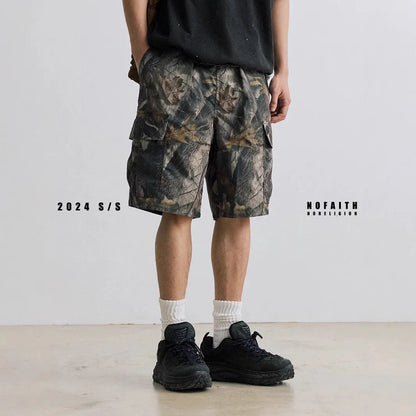 Women's loose fit denim shorts in army green colour, showing straight-leg cut and zip placket.