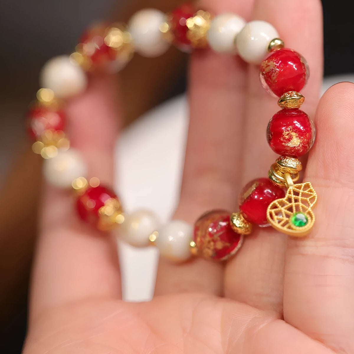 Women's geometric ethnic style bracelet with gold foil decoration on coloured glaze in two colour variations