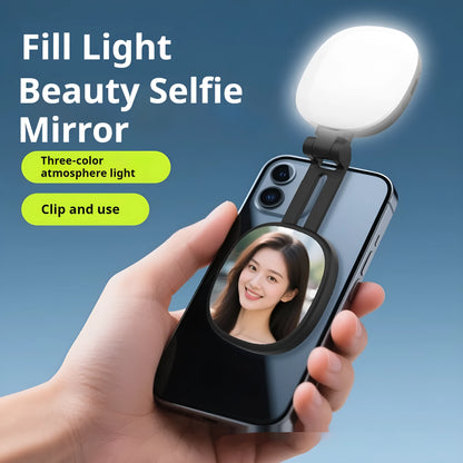 Black and white mini mobile phone fill light with magnetic holder attached to a smartphone