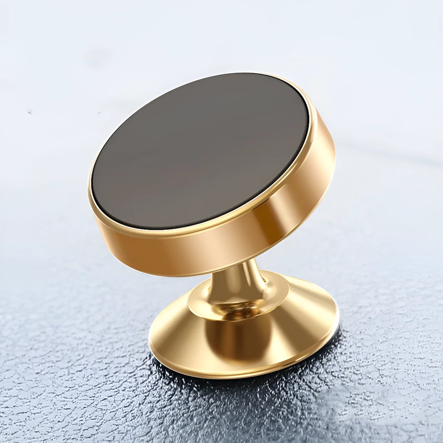 Silver aluminium alloy magnetic car phone holder with rotating ball head mounted on a car air vent.