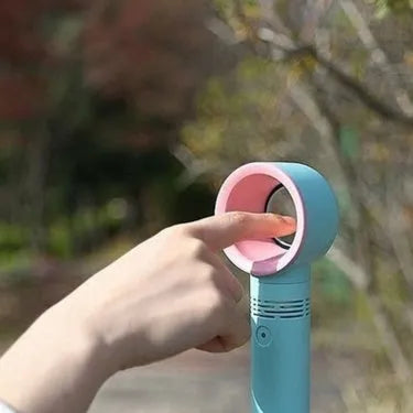 Portable bladeless fan with USB cable and base, showing compact design and bladeless airflow