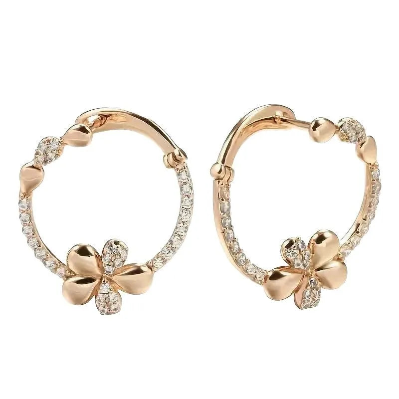 A pair of round ring earrings for women made from electroplated copper with a geometric design.