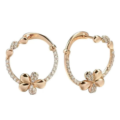 A pair of round ring earrings for women made from electroplated copper with a geometric design.
