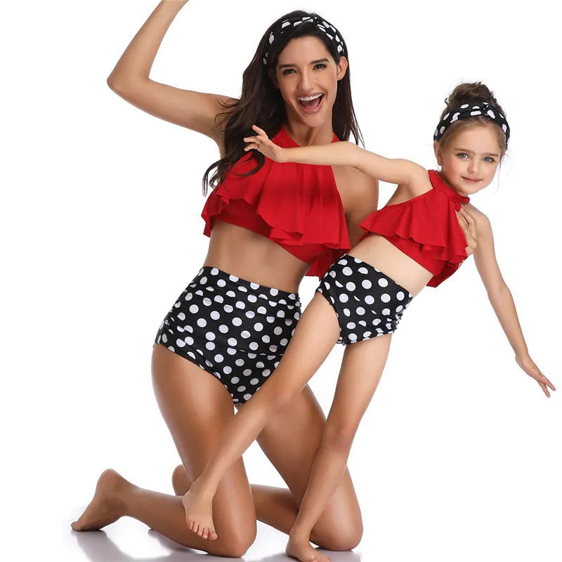 Nylon one-piece swimsuit with chest pad, available in flower, orange, and red, adult and child sizes.
