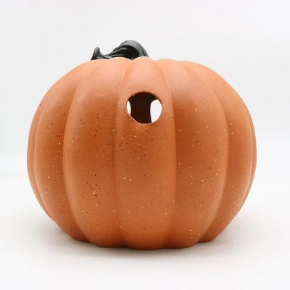 Yellow Halloween pumpkin lantern with hollow-out skull hooded design, resin prop measuring 23 x 19cm