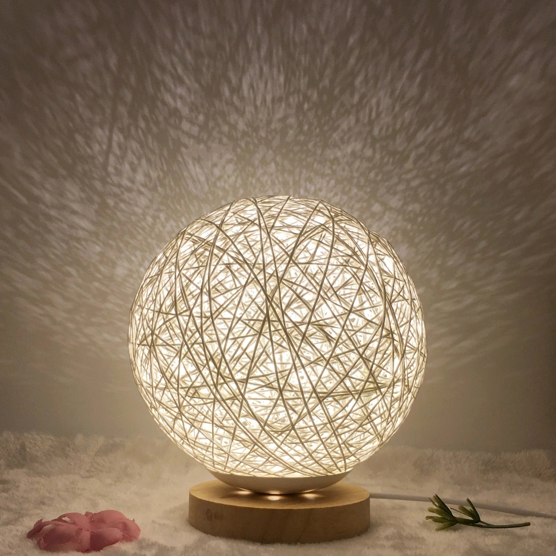 LED rattan table lamp with hand-knit linen shade in various colours