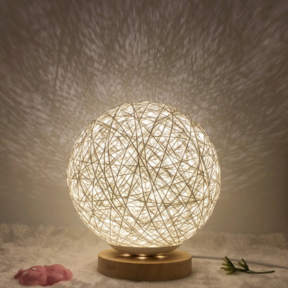 LED rattan table lamp with hand-knit linen shade in various colours
