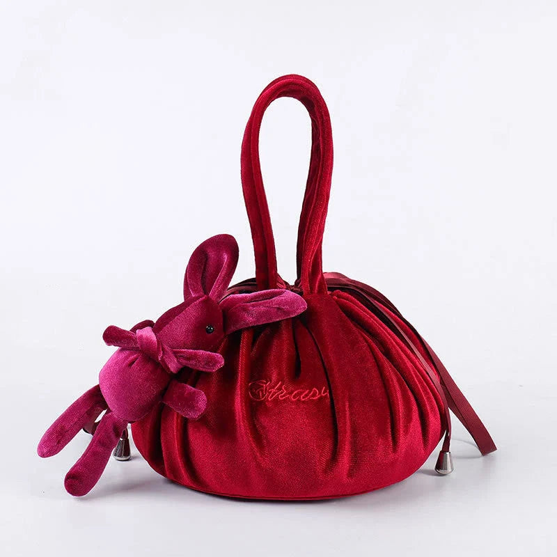 Adorable rabbit ear velvet cosmetic bags in various colors for storing and organizing makeup, toiletries, and other beauty essentials.