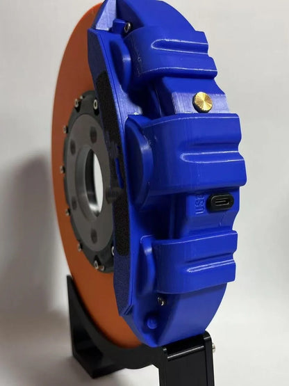 Brake disc design LED night light with caliper details in blue, red, or yellow colour options on desktop