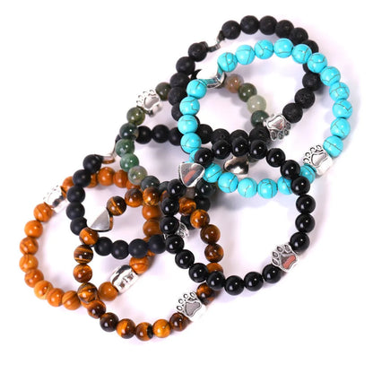 Tiger's eye stone bracelet with dog paw and Indian agate beaded designs on a wrist.