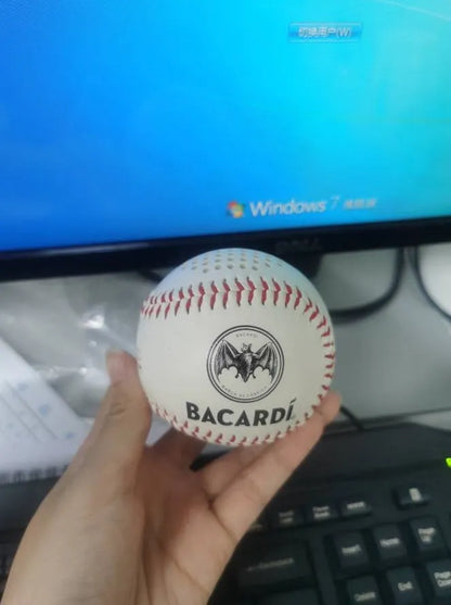 A green Bluetooth speaker shaped like a baseball with a USB port.