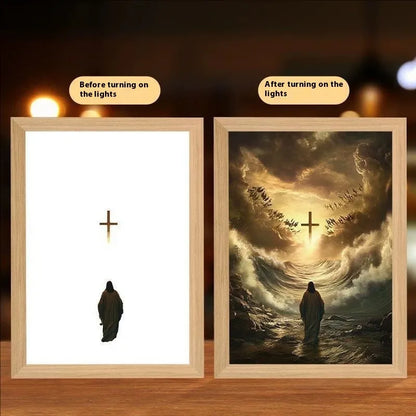 Modern rectangular light painting photo frame displaying an illuminated cross and scenic artwork.