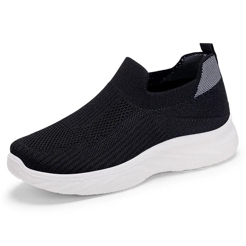 Women's Flyknit casual running shoes with soft PVC sole in black, grey, pink, and blue colour options.