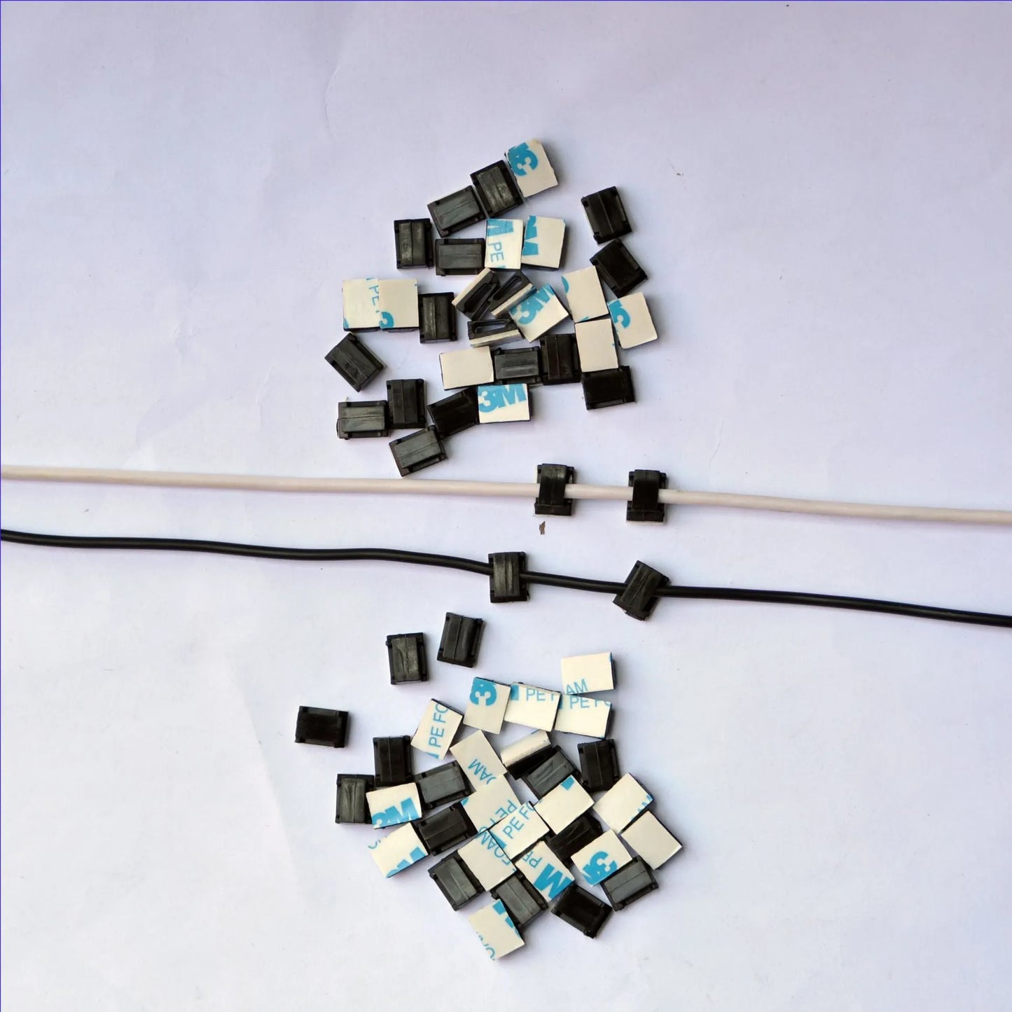 Black PA66 nylon car wire retaining clip for managing automotive and LED electronic cables.