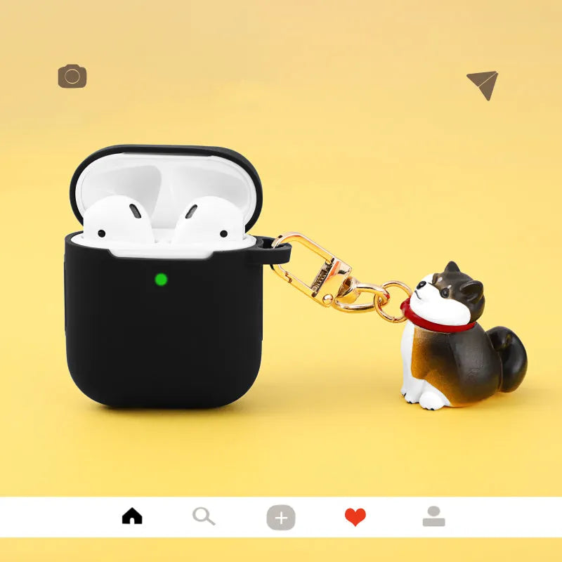 Silicone AirPods case with Shiba Inu pendant in yellow, white, or black, universal fit for AirPods 1 and 2.