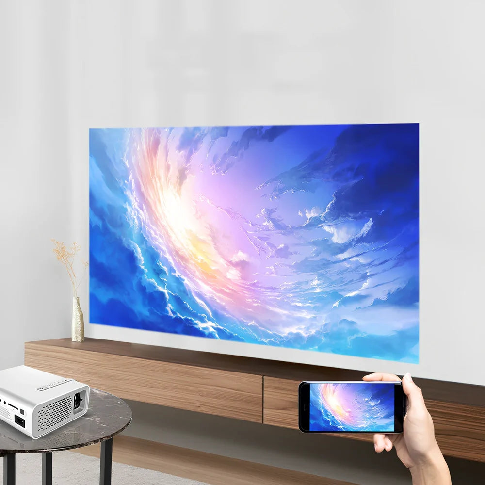 White portable home projector with remote control displaying 1024*600 resolution image