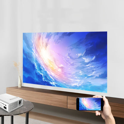 White portable home projector with remote control displaying 1024*600 resolution image