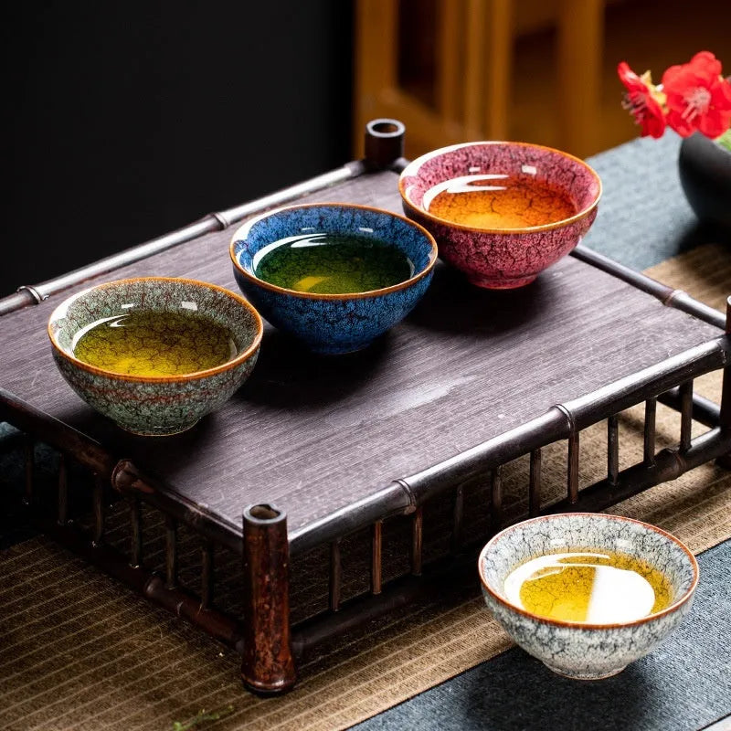 Set of four new Chinese style ceramic Kung Fu tea cups in a light-coloured gift box.