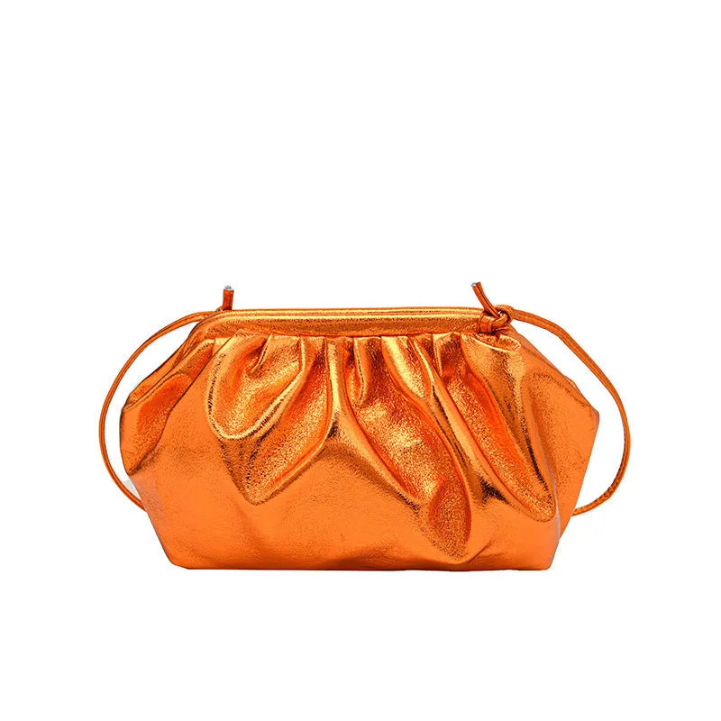 Simple hair clip shoulder crossbody bag in shell shape with visible sewing lines, shown in rose red colour.