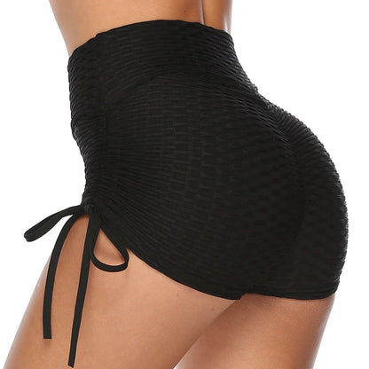 Curve-enhancing workout shorts in a variety of vibrant colors with a drawstring waistband for a customized fit.