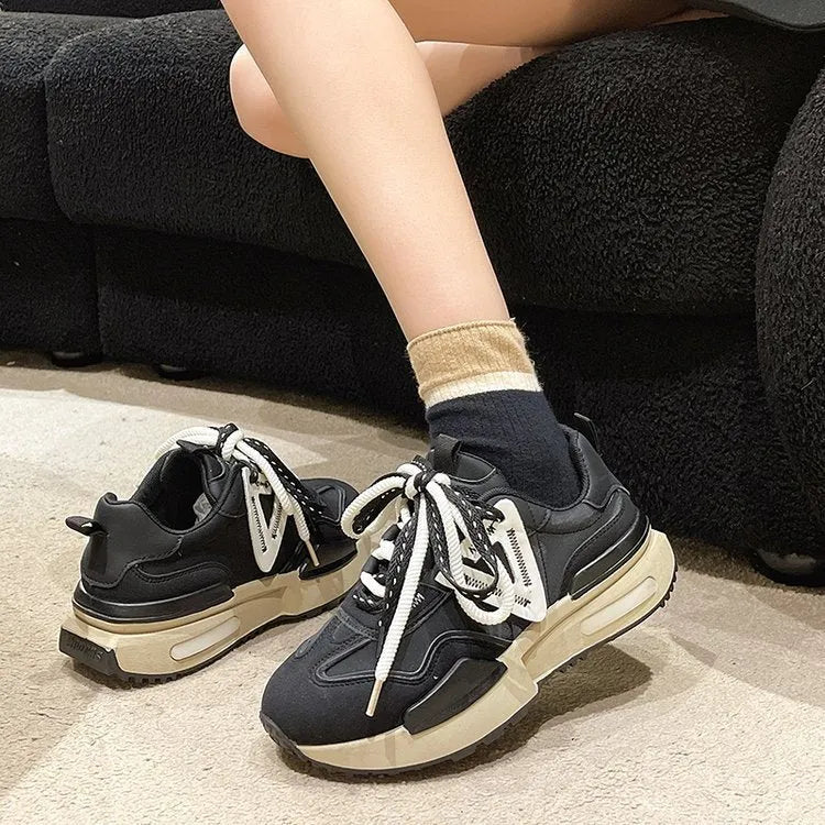 Women's retro platform sports shoes in black colour with lace-up front and rubber sole