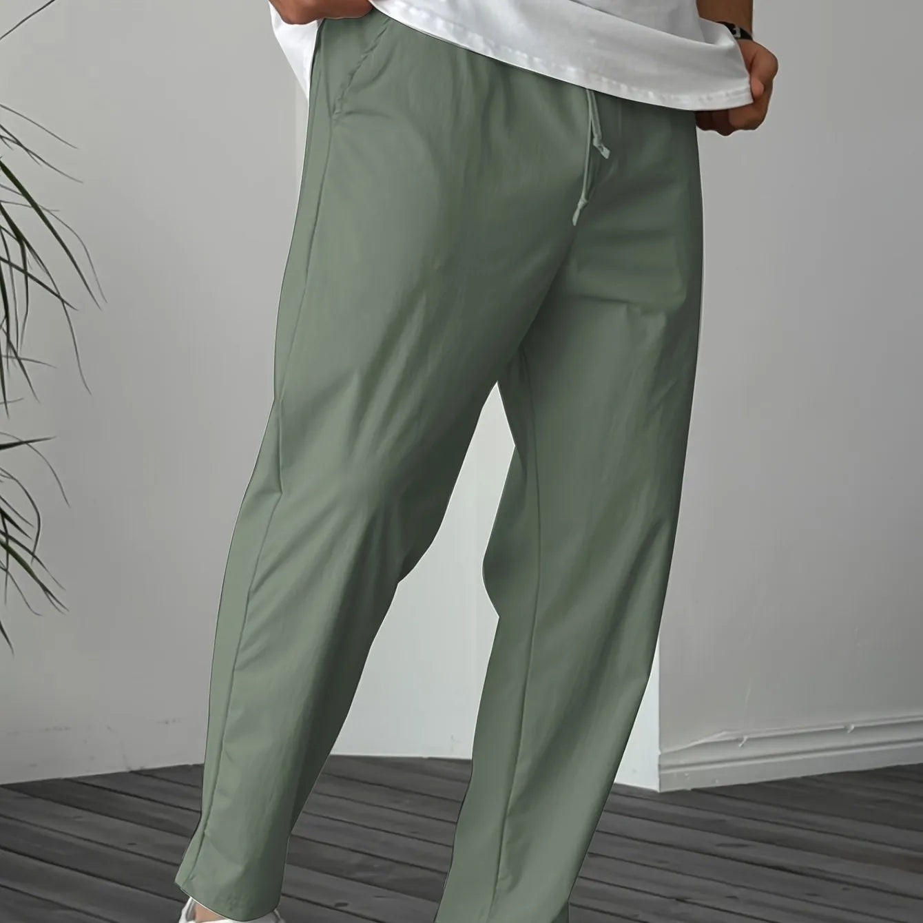 Men's khaki drawstring trousers with ribbon-trim pockets and straight-leg fit