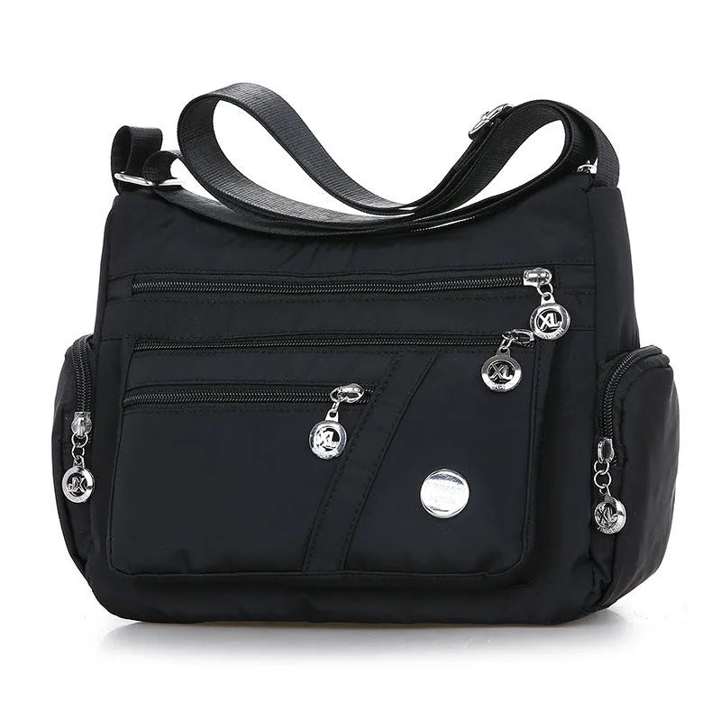 Women's nylon shoulder bag with multi-pocket design, zip opening and detachable handle in red, purple, black or army green