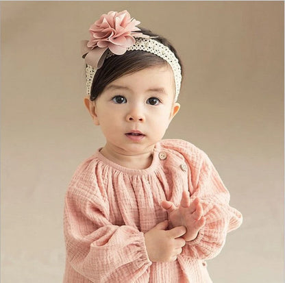 Baby lace headband with floral design in pink, grey, and rose red