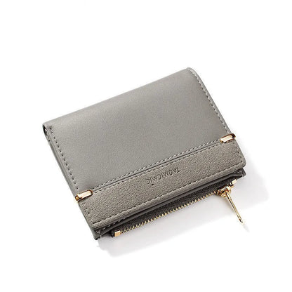 Multi card slot short zipper ladies wallet in 2-fold design with PU leather exterior showing internal compartments