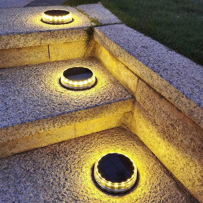 Square solar buried light with solar panel, 121mm dimensions, installed flush with ground surface