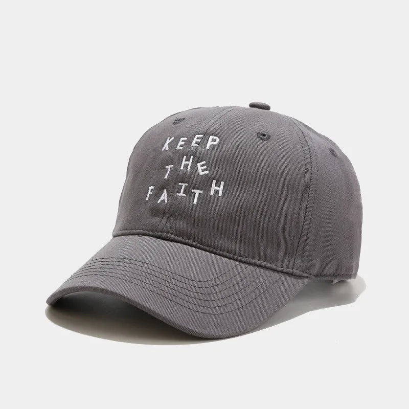 Men's cotton baseball cap with small embroidered letters on front in adjustable dome design