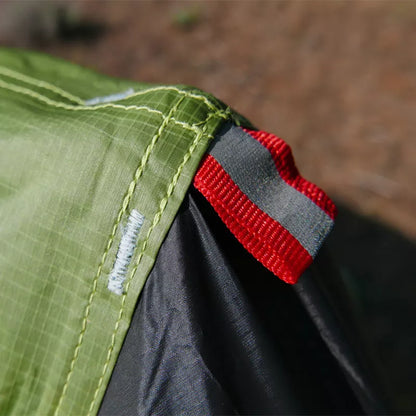 Silicon-coated poleless tent in camouflage green, featuring rainproof design and lightweight aluminum poles