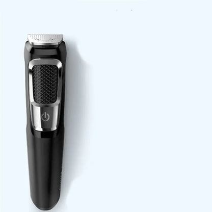 Standard colour multifunctional nose and beard hair clippers with cleaning brush on a white background.