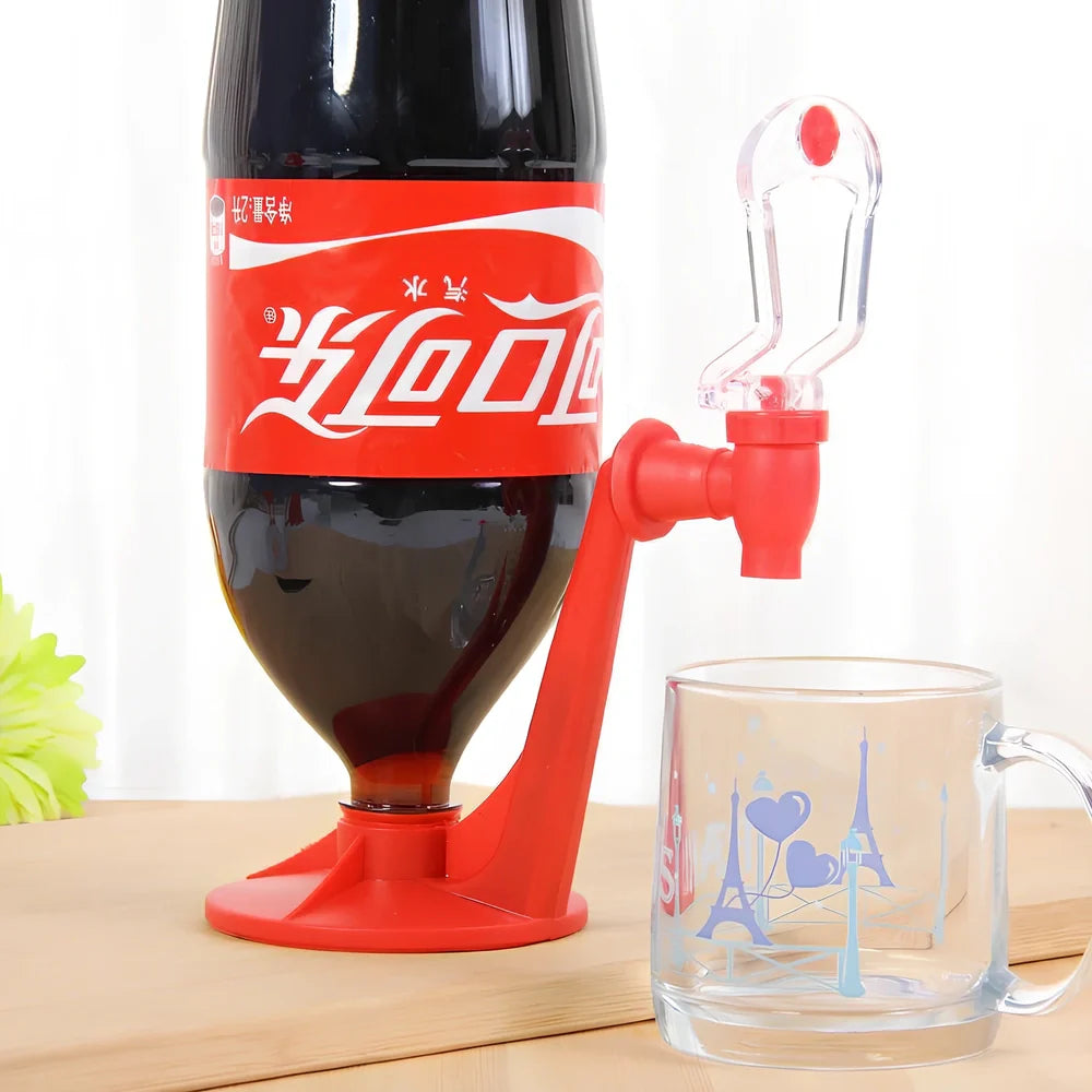 Red automatic soda dispenser gadget attached to beverage bottle for hands-free pouring