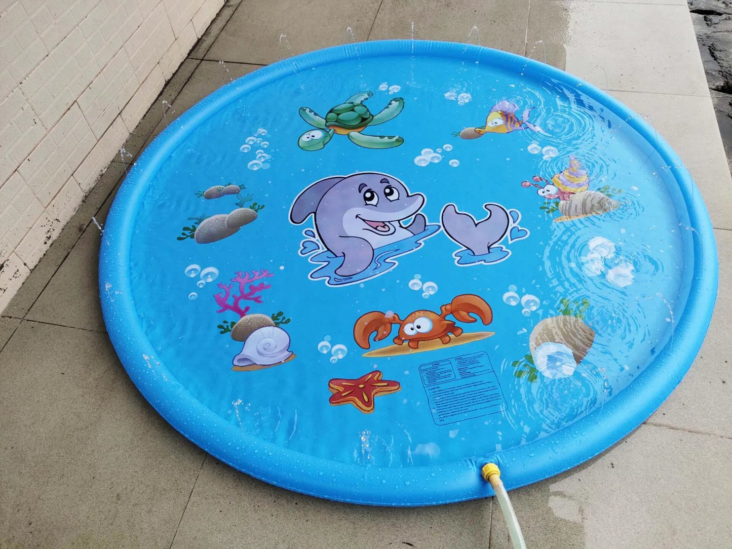 Blue PVC children's water spray play mat with marine animal prints measuring 100cm by 170cm