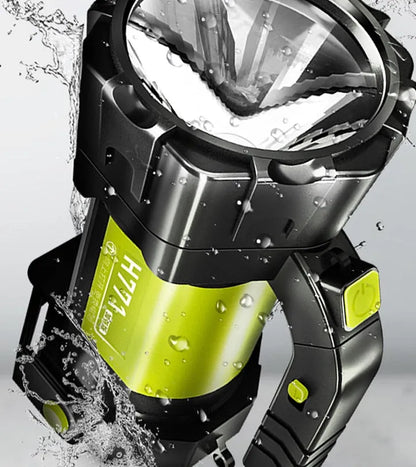 H771 portable LED searchlight in orange or green with shoulder strap and removable battery.