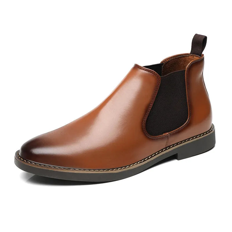 A pair of formal black leather pointed-toe boots with a square heel and rubber sole