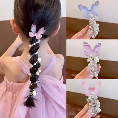 Colourful butterfly and pearl elastic hair band for children on a white background.