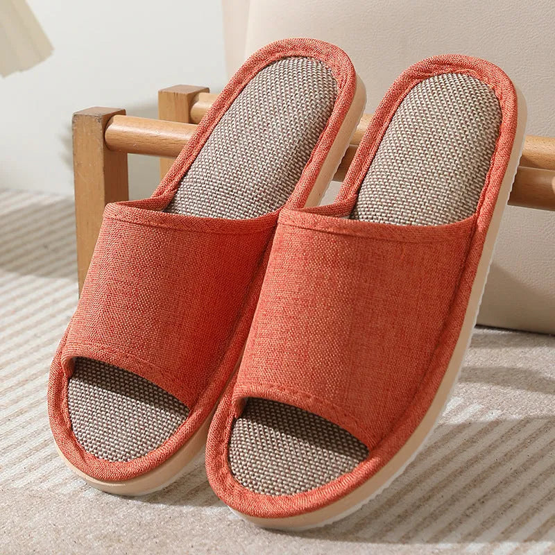 Women's open-toe linen slippers with thick sole in light brown colour.