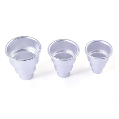 Set of three silver aluminium alloy cake moulds in large, medium, and small sizes.