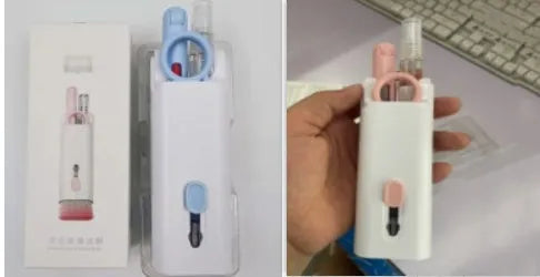 White electronics cleaning kit with a cleaning pen, spray bottle, brush, and keycap puller on a table