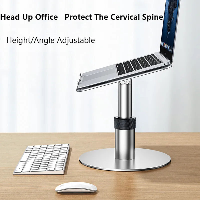Silver adjustable aluminium car laptop stand with rotating base shown supporting a laptop.